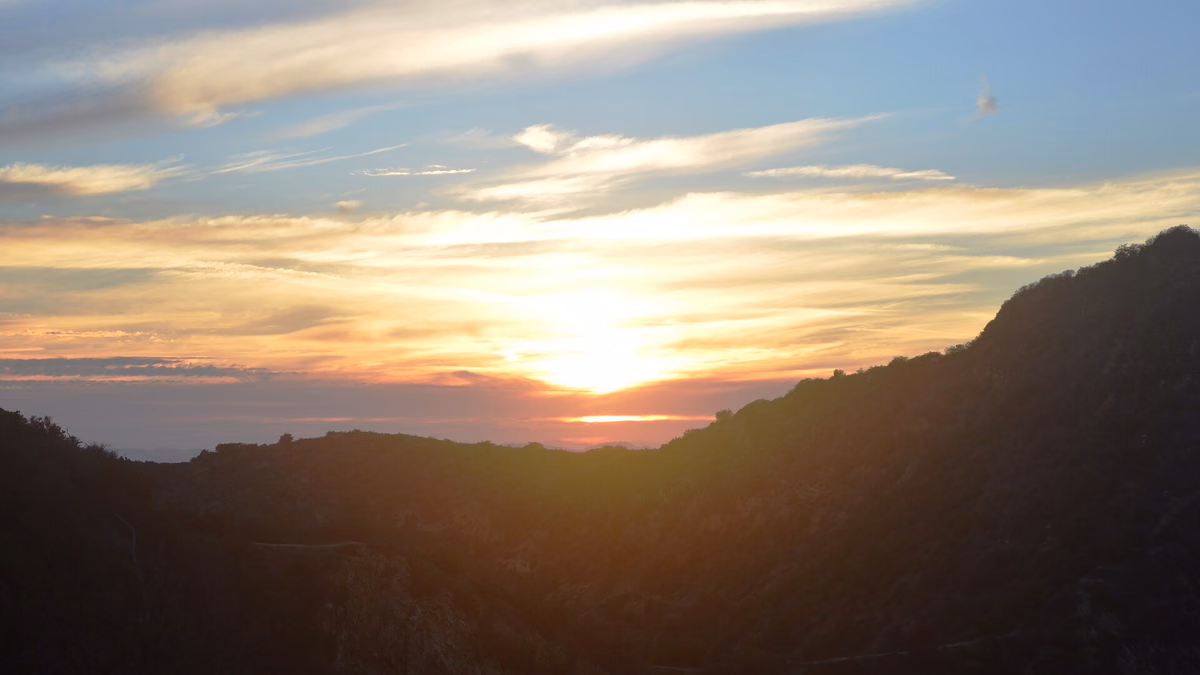 Watching sunset over Hollywood Hills from above the Hollywood Sign