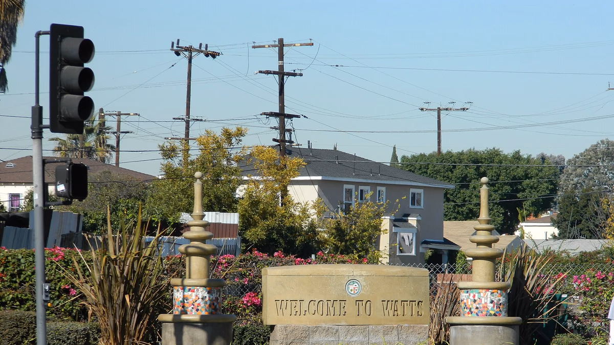 Sign welcoming visitors to Watts California