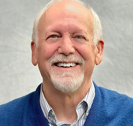 Dr. Kevin Downing smiling in a professional headshot