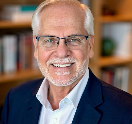Dr. Peter Robbins smiling in a professional headshot