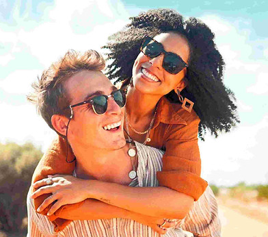 A couple smiling together outdoors