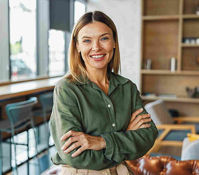 A woman smiling in a calm office setting