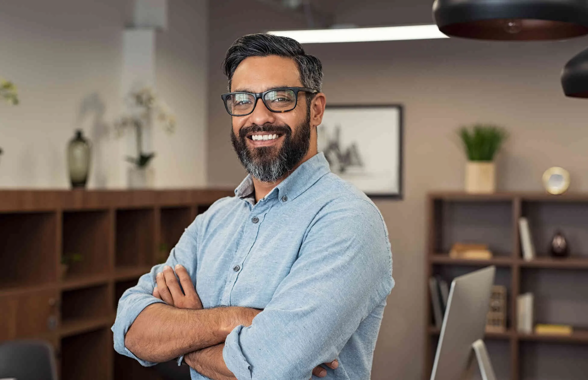 A man smiling in a professional office