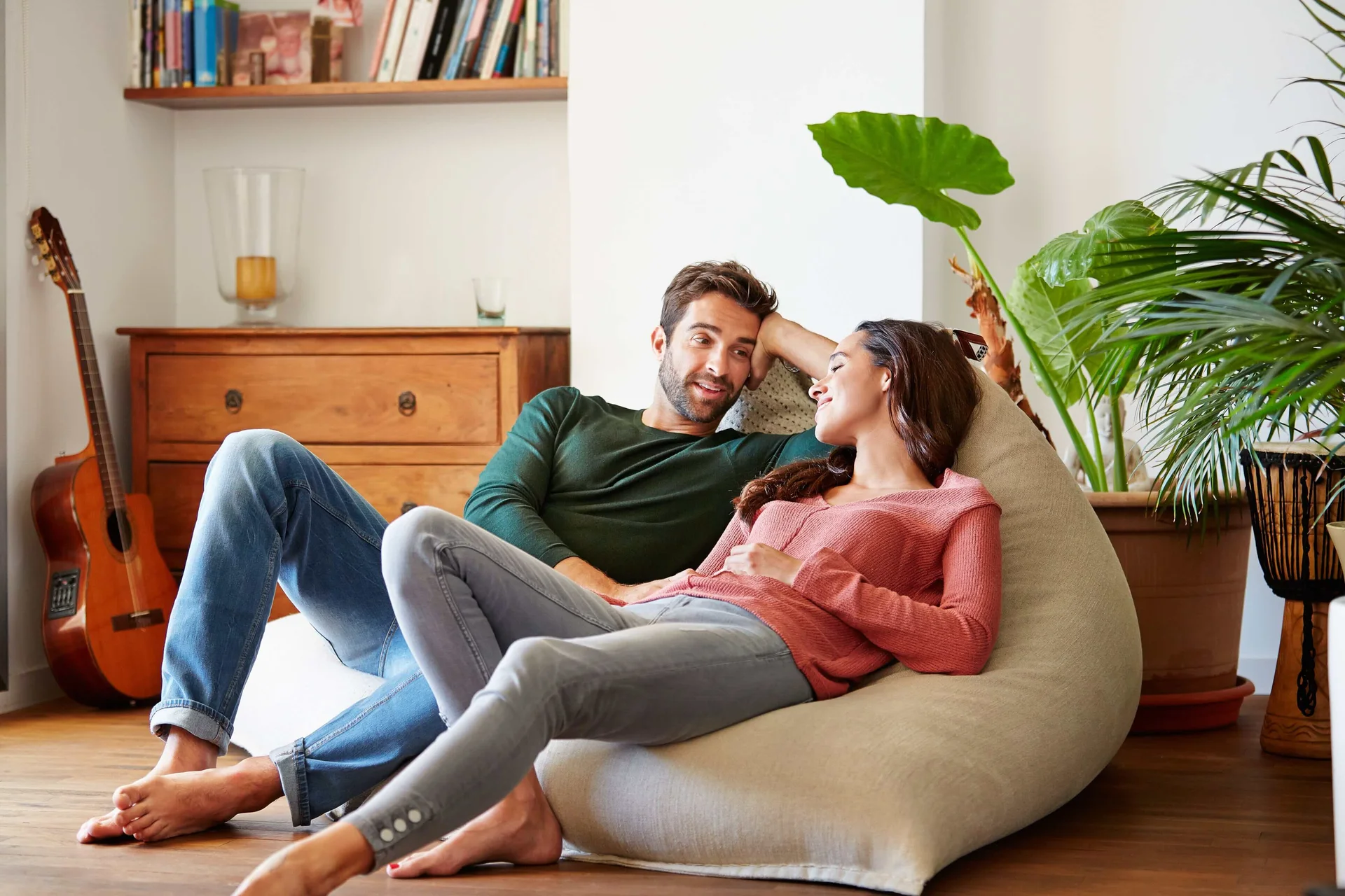 A couple relaxing and talking together at home