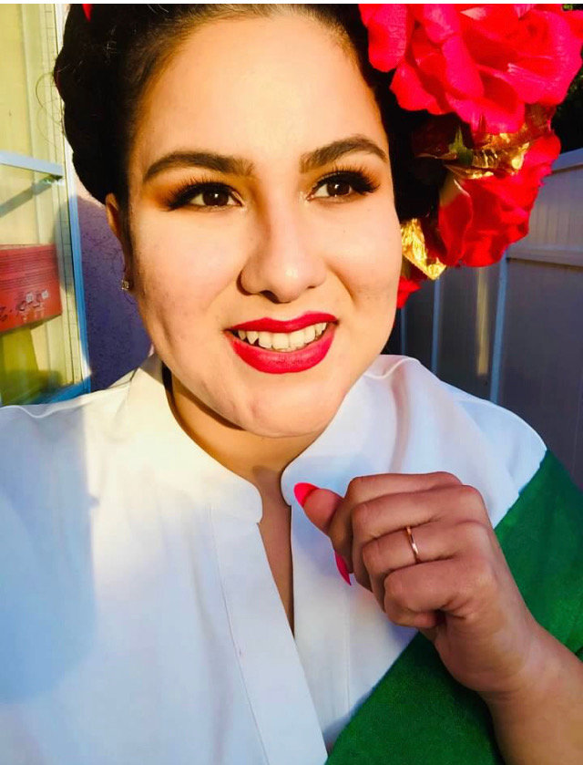 Bianca with a flower.